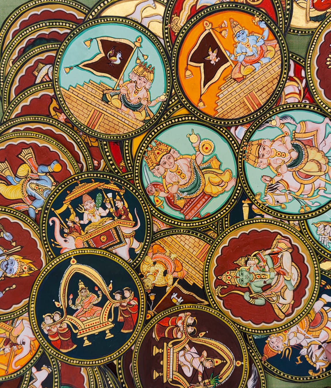 Close-up of overlapping hand-painted Aṣṭa-Aiśvarya Gañjifā cards